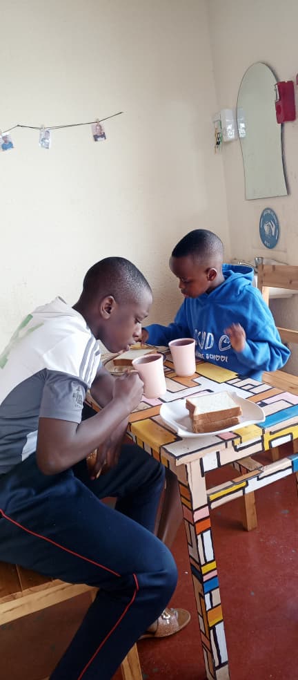 Children learning table setting