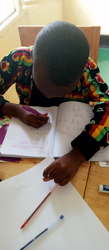 Child with autism engaged in one-on-one learning with teacher